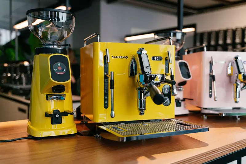 Yellow Sanremo Cube with a grinder on a counter