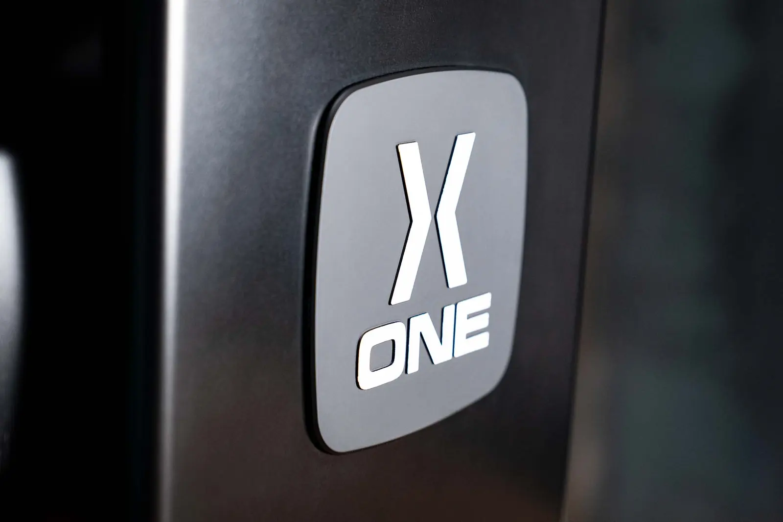 X-ONE logo on the grinder body