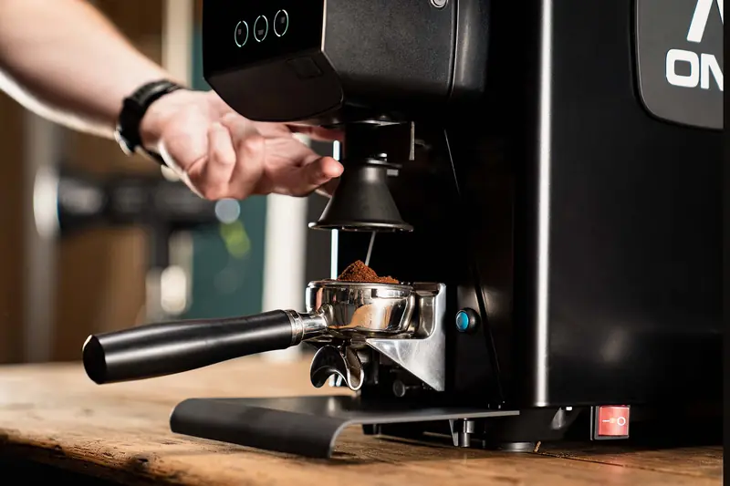 Grinding coffee into a portafilter on the Sanremo X-ONE