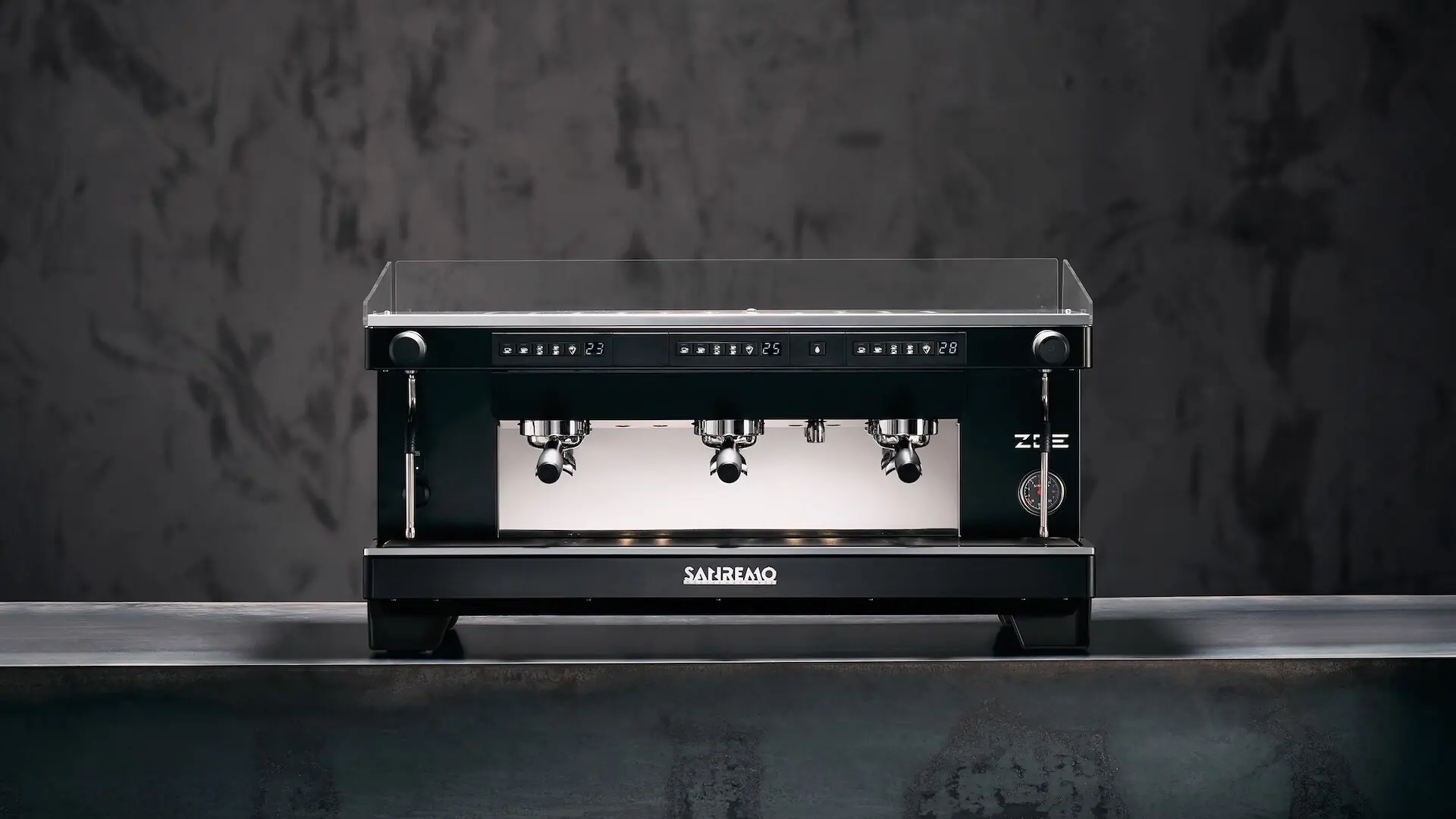Sanremo Zoe Total Black espresso machine, 2 groups, on a concrete counter